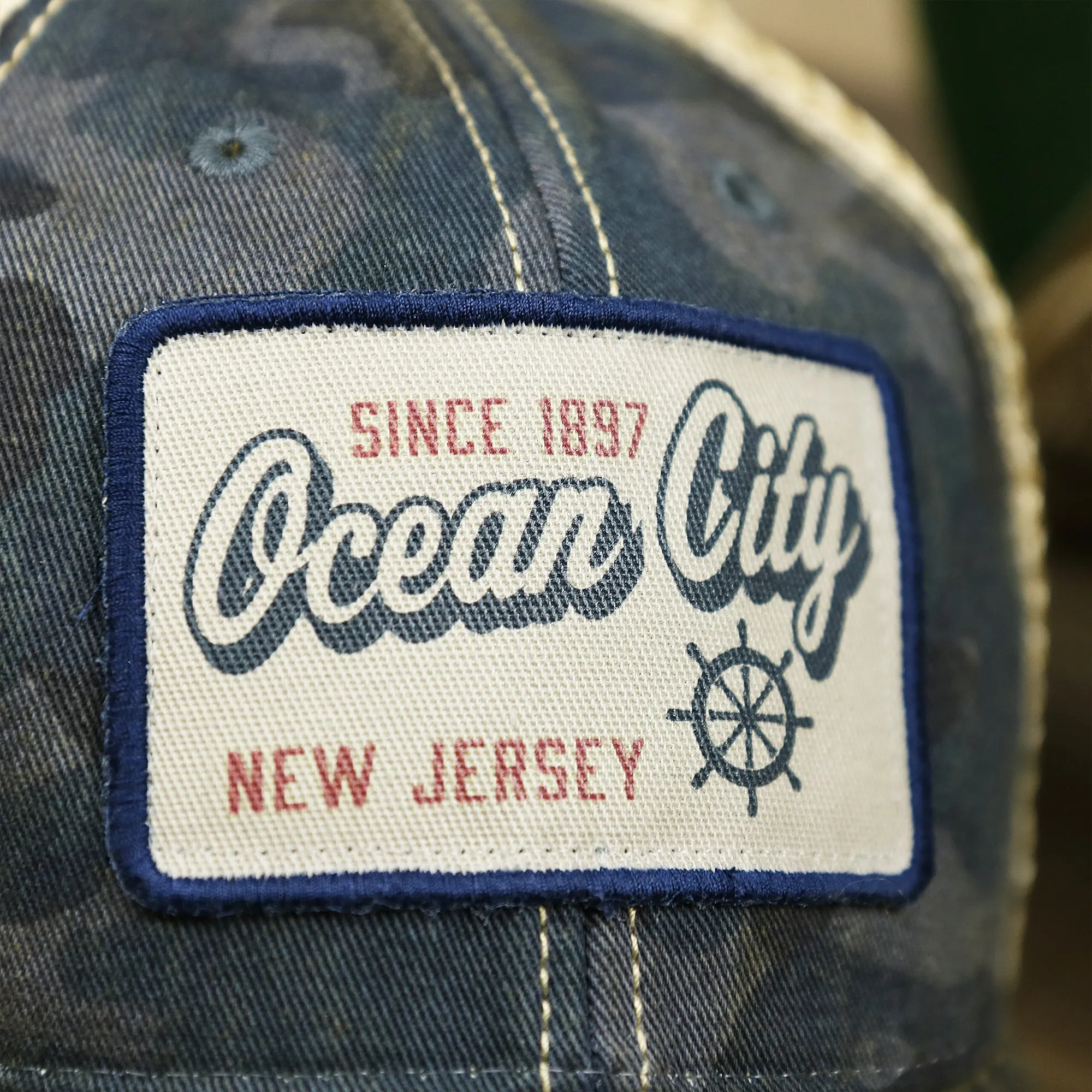 Ocean City New Jersey Since 1897 Helm Patch Camo Print Mesh Back Trucker Hat | Camo Navy Blue Trucker Hat